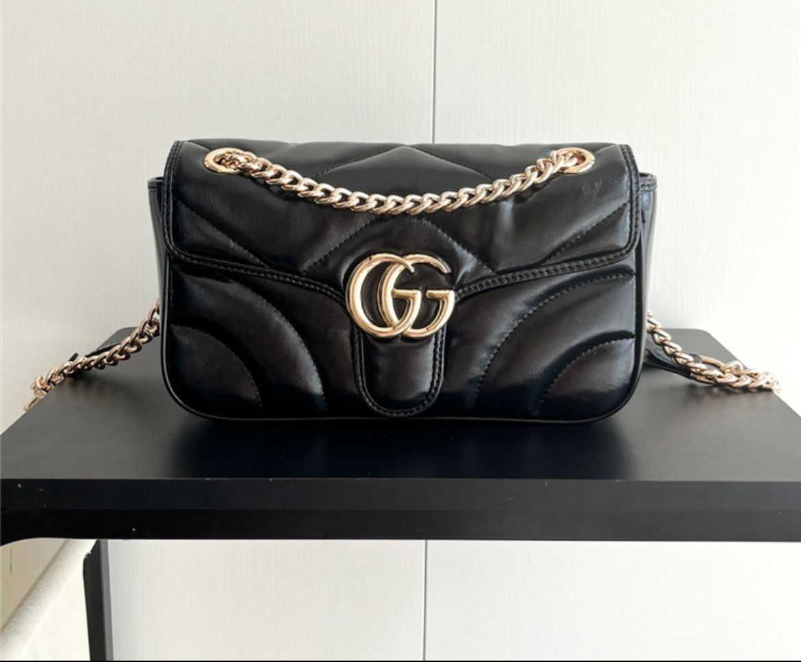 Black Gucci With Gold Letters Handbag