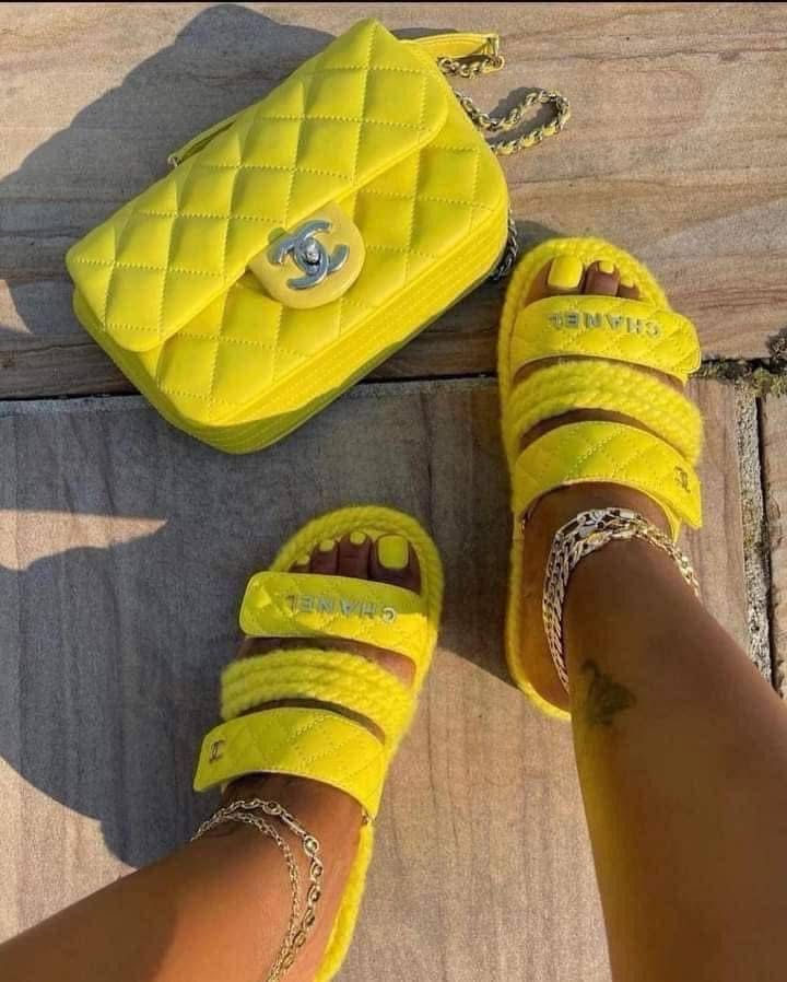 Yellow Chanel slides and bag