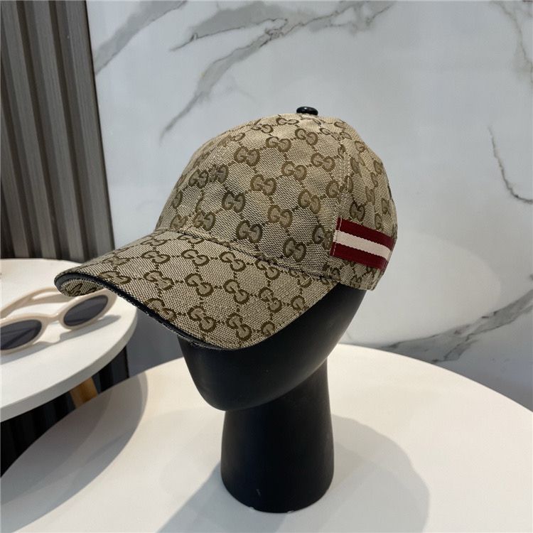 Brown Gucci Hat with red and white stripe