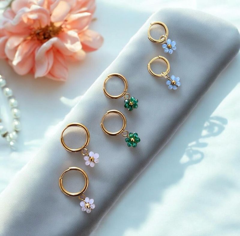 Boucle d’oreille fleur rose pale