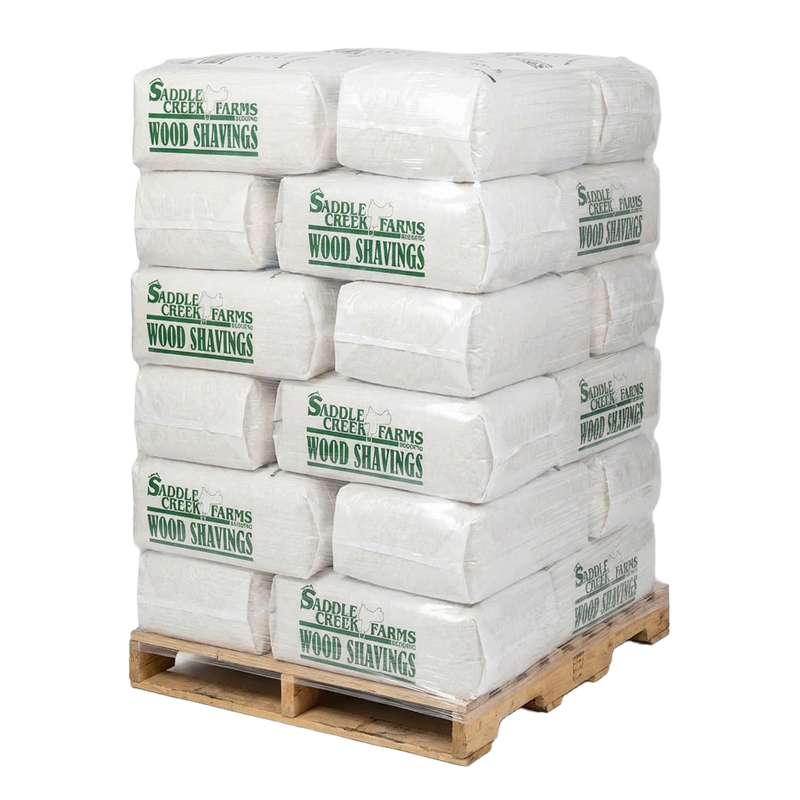 SCF Small Flake 30-bag pallet on warehouse floor — premium equine bedding