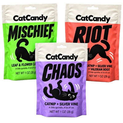 CatCandy Trouble Trio with green Mischief and red Riot 1 oz pouches behind a purple Chaos pouch
