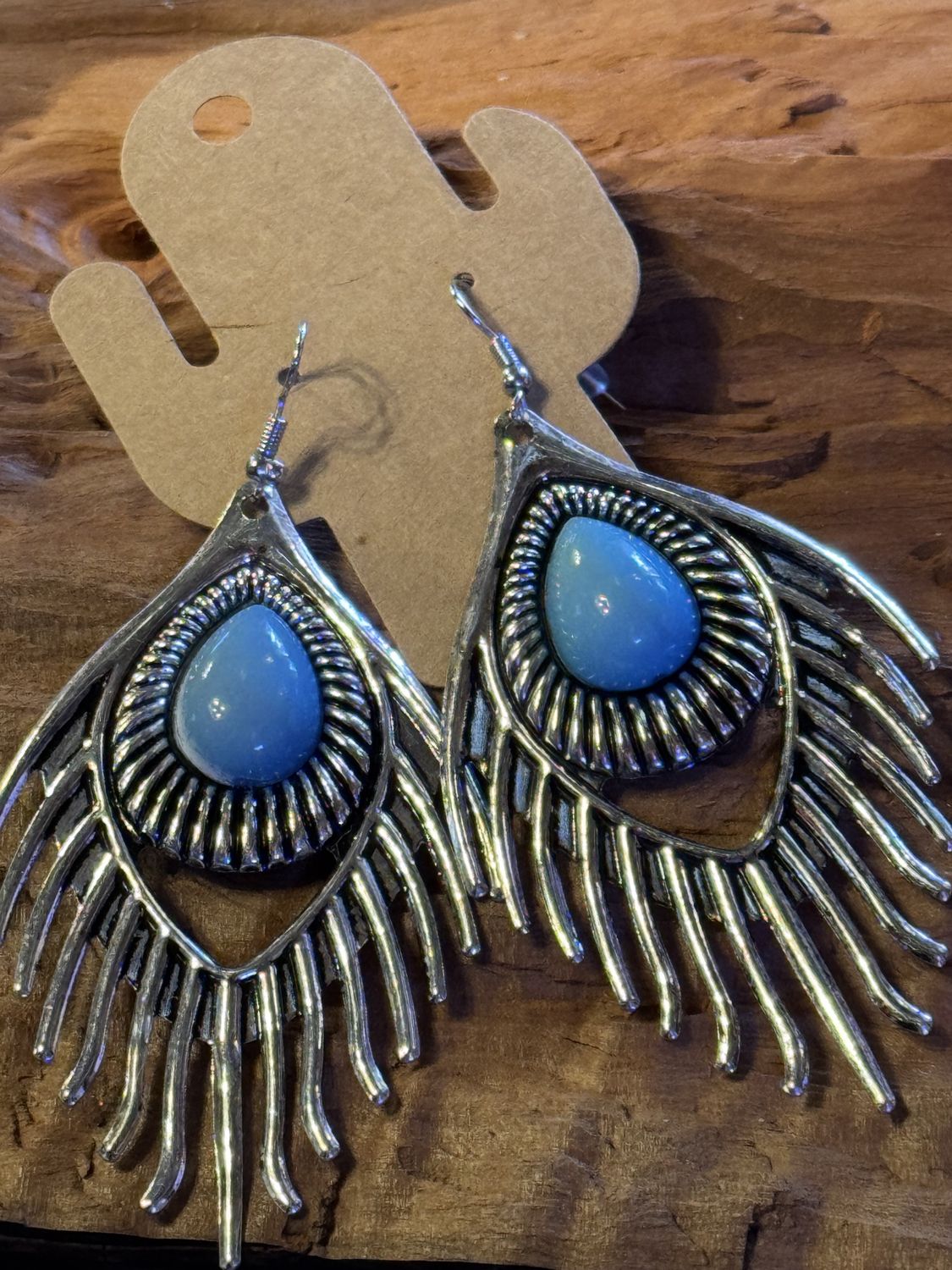 Silver Feather Drop Earrings with Blue Stone Accent