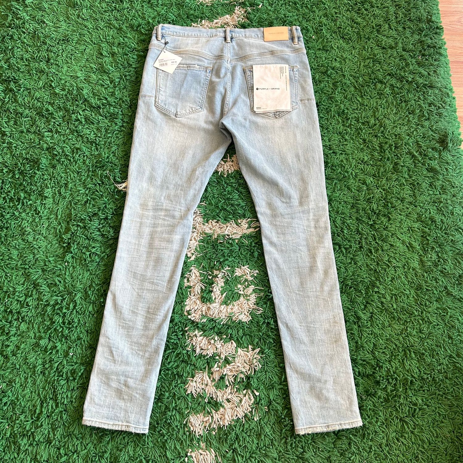 PO PURPLE P002 SLIM LEG LIGHT WASH KNEE HOLES SIZE 34