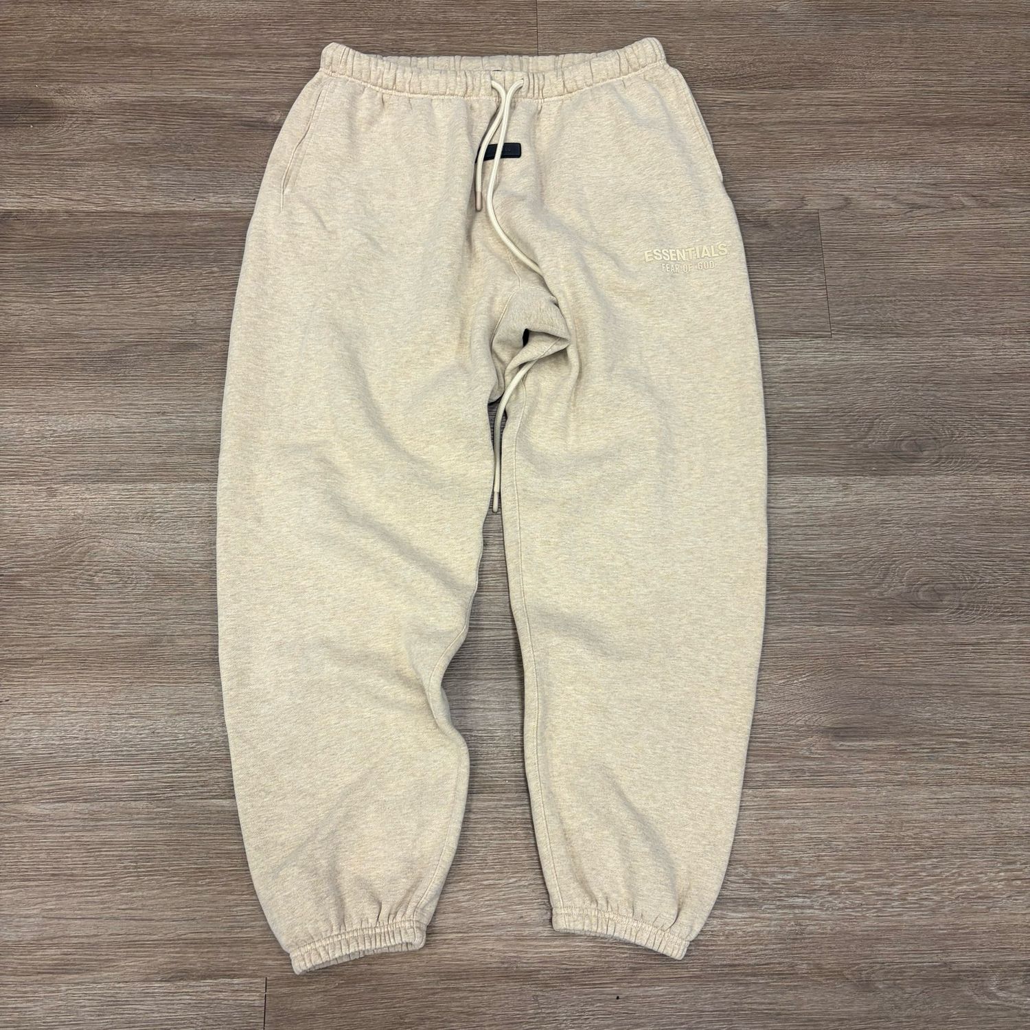 PO FEAR OF GOD ESSENTIALS OATMEAL HEATHER CUFFED SWEATPANTS SIZE L