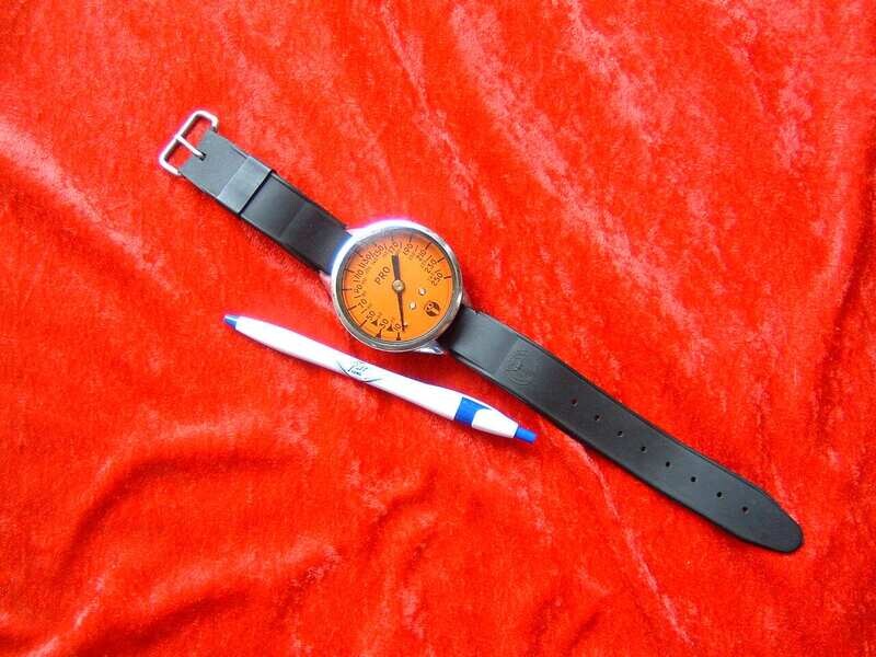 US Divers orange faced brass and glass wrist depth gauge NUC 16 marked