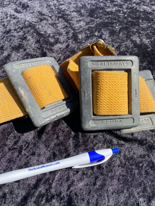 Healthways early one pound weights with two inch belt and wire buckle.