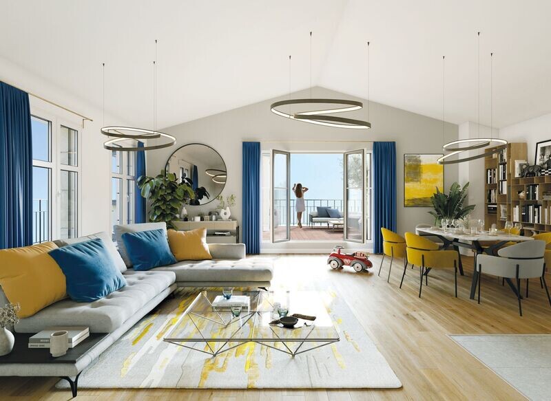 Intérieur d'une grande pièce de séjour d'un appartement donnant sur une terrasse