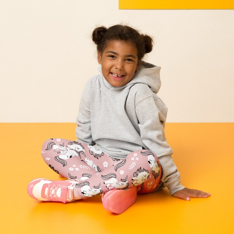 Children&#39;s pink leggings with unicorn