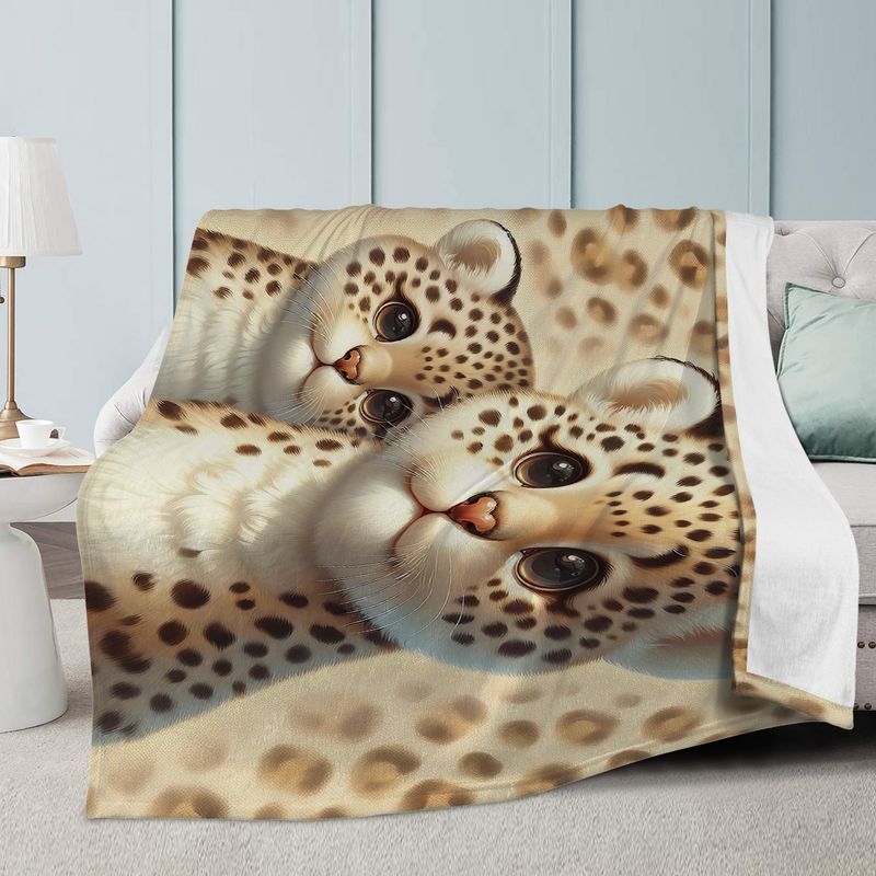 Beige cuddly blanket with a leopard motif