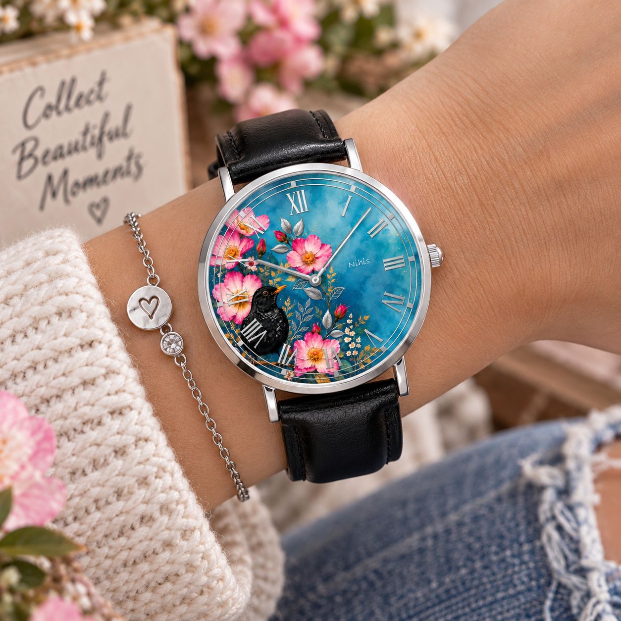 Silver leather wristwatch with blackbird motif