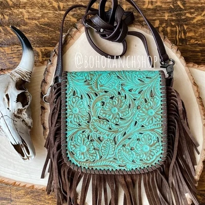 Laser cut crossbody turq. purse