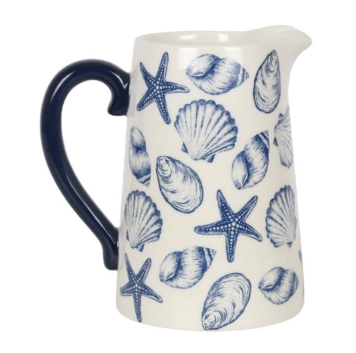 This ceramic flower jug will add a calming, nautical touch to the home with a stunning seashell design and contrasting handle. Perfect for holding flowers as a vase or gifting for Mother&#39;s Day, teache