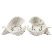 A box of two white resin angel wing Holders
