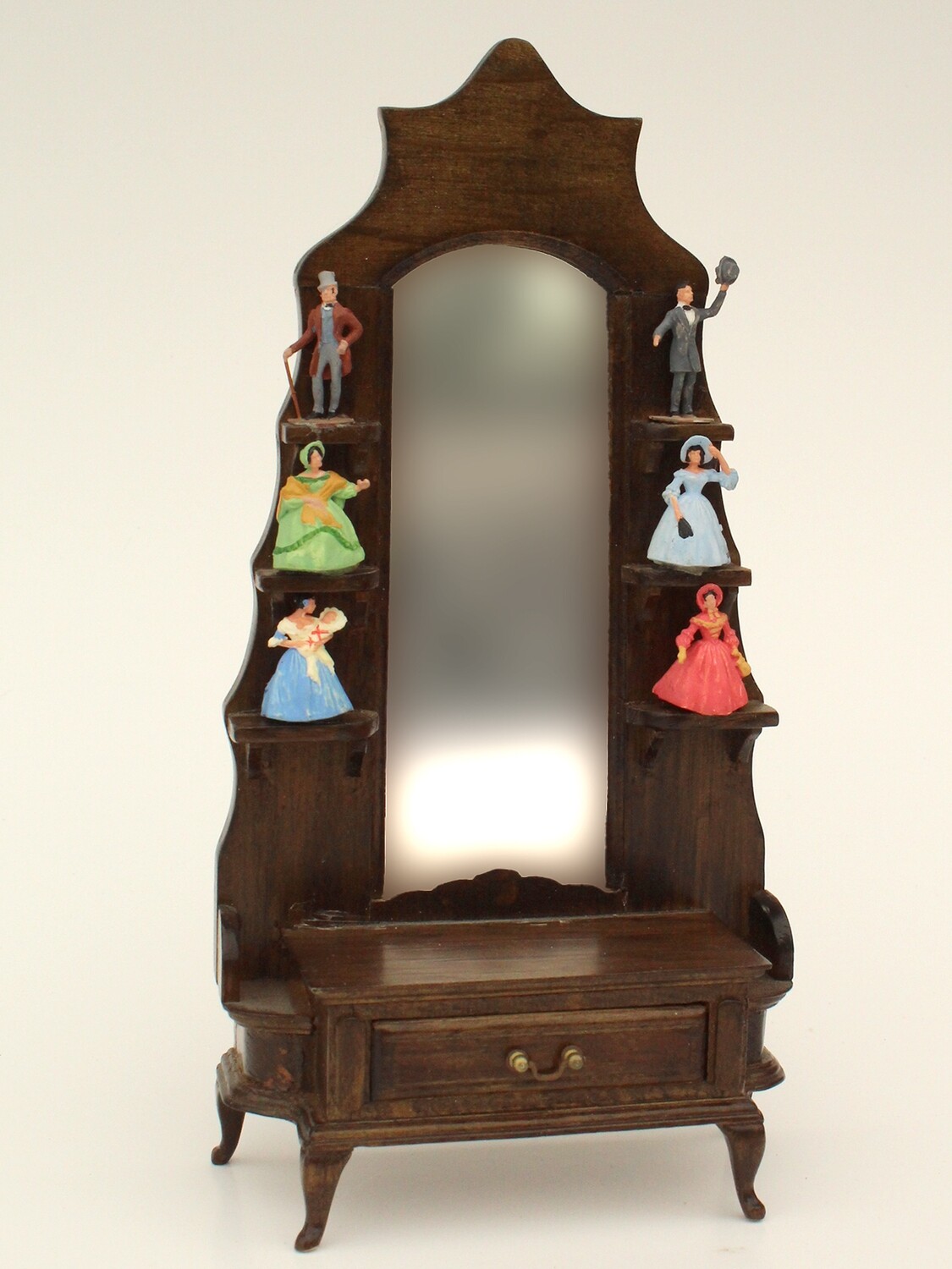 Mirror shelf with tiny figures