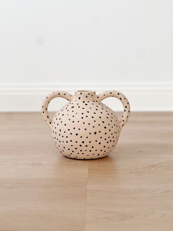 small ceramic vase with black dots