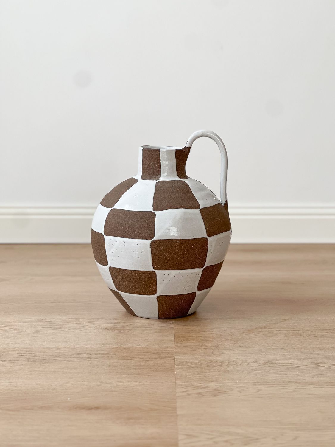 brown and white ceramic vase