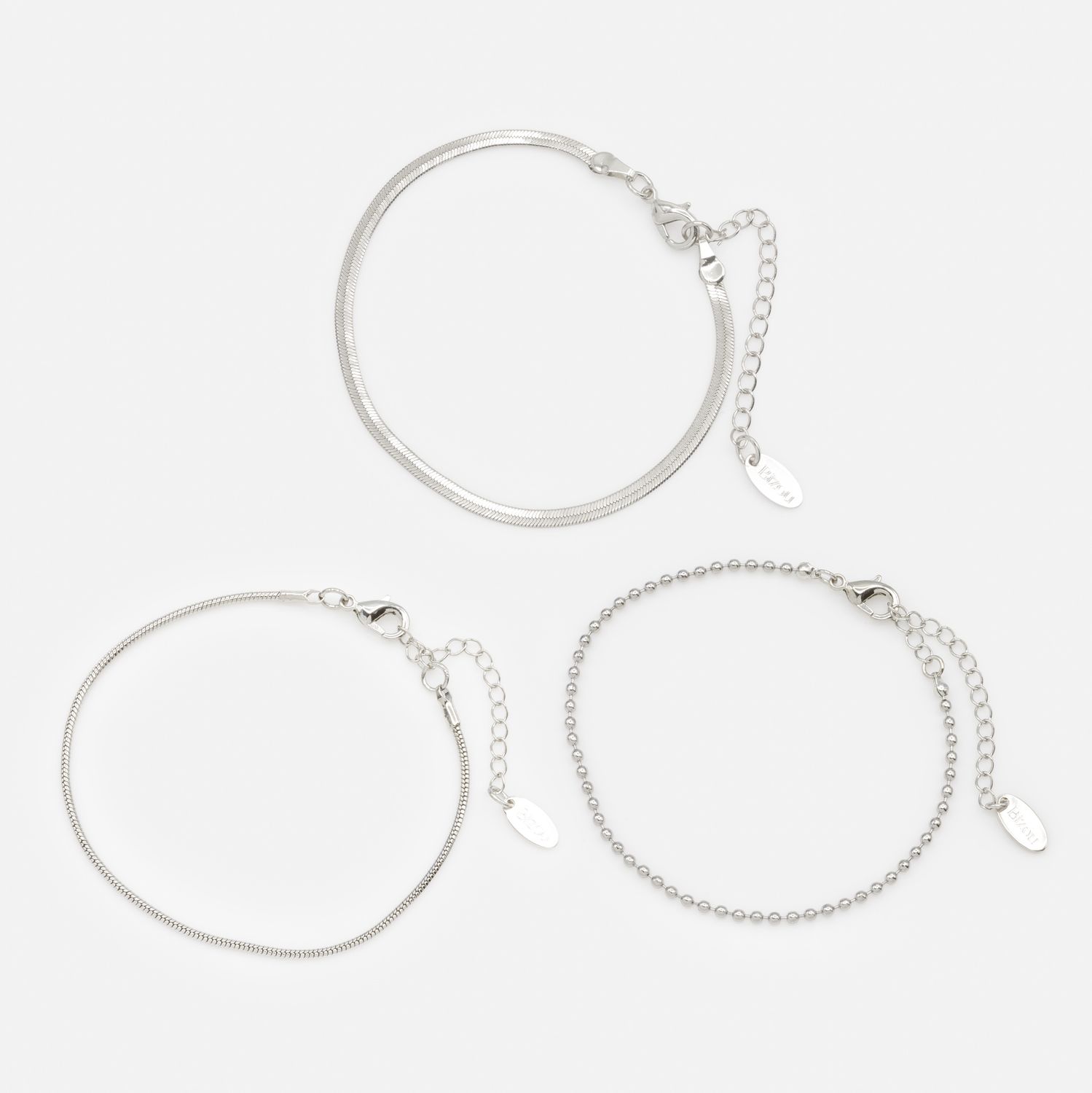 Trio de bracelets argentés à mailles variées
