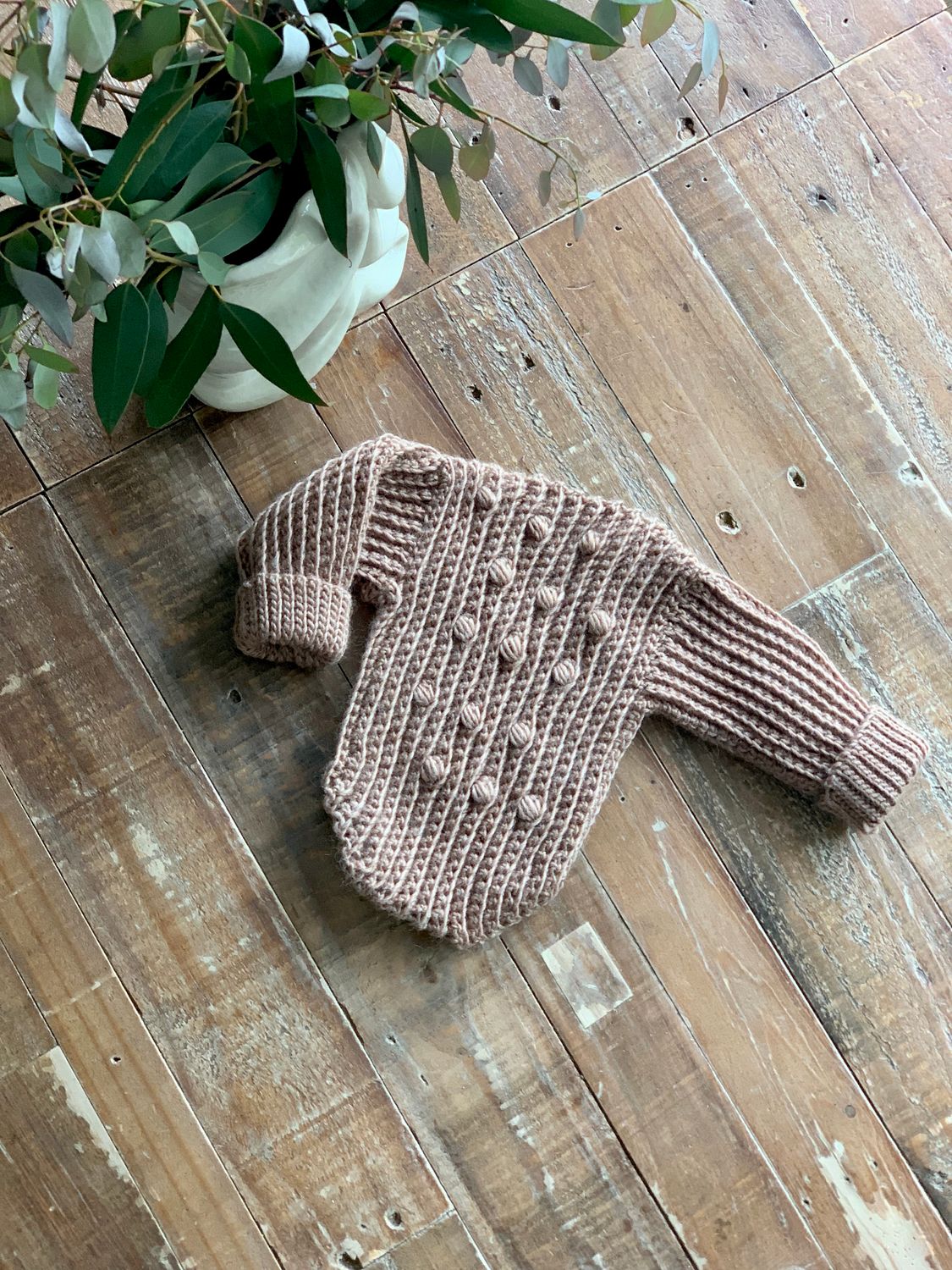 Petit newborn body suit with sleeves