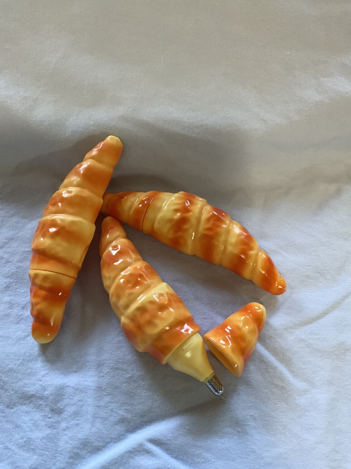 Imitation bread and crescent ballpoint pen.