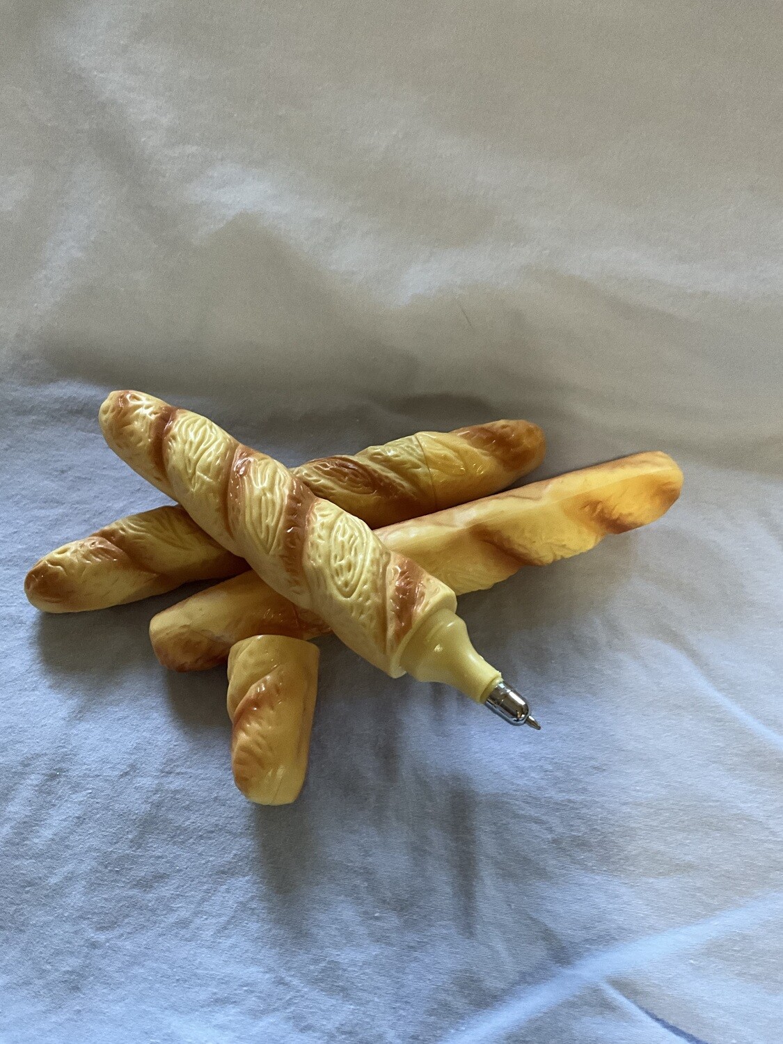 Imitation bread and crescent ballpoint pen.