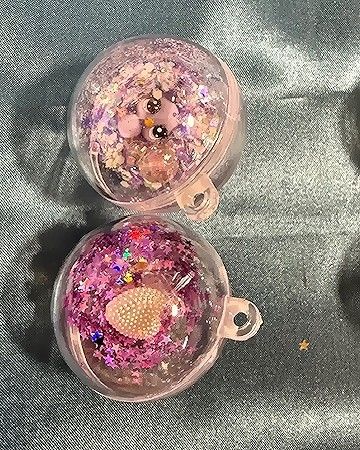 Small Globe one with white/purple sequence and little Kitty the other with Purple Star Sequence and White Heart.