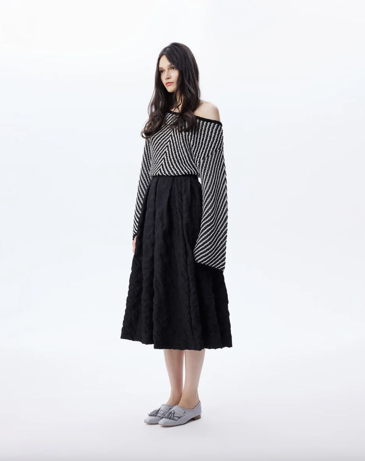 THEO The Label Calypso Pleated Midi Skirt