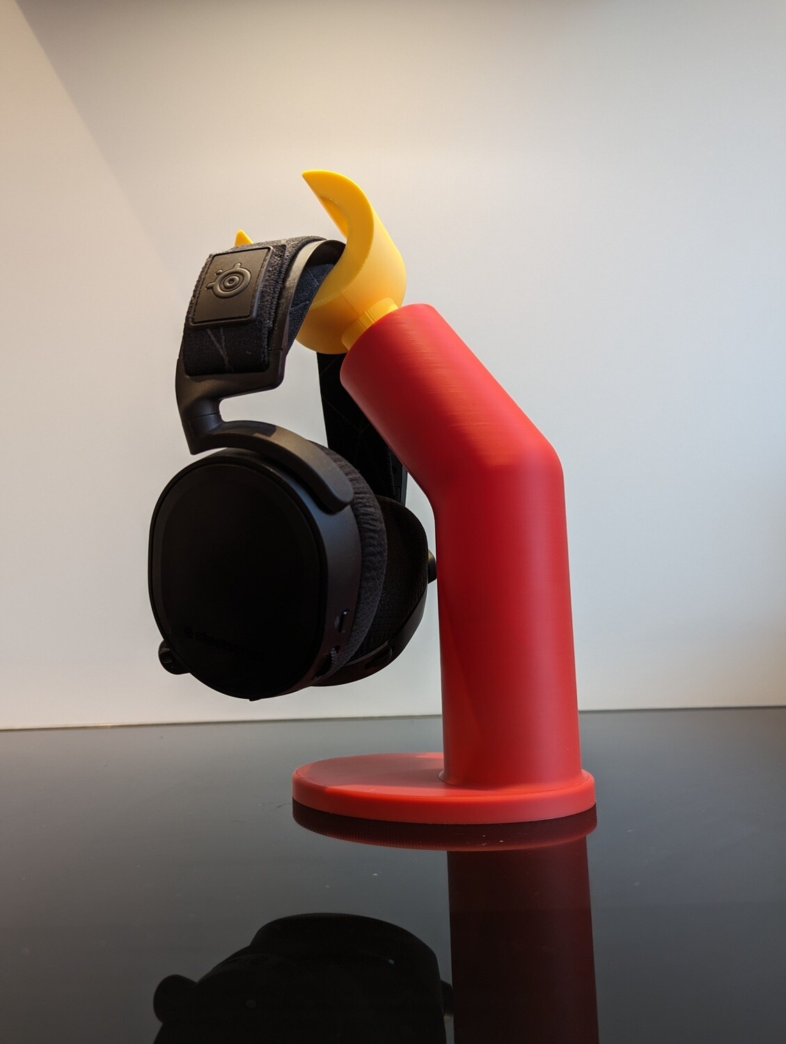 Headphone stand in the shape of a Lego arm