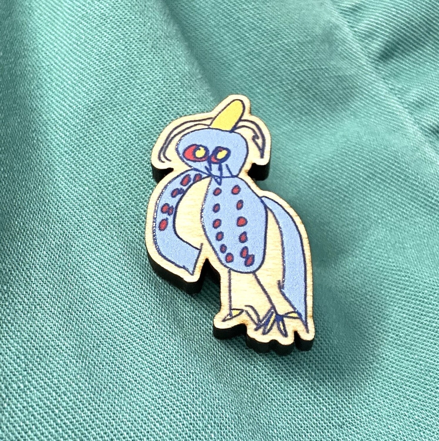 The Perfect Blue Birds (Goose with Yellow Hat) pin, designed by Tamisha Williams