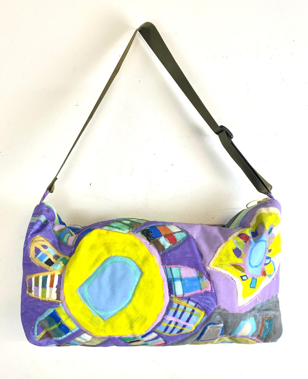 Quilted flower pattern shoulder bag by Mary T Bevlock