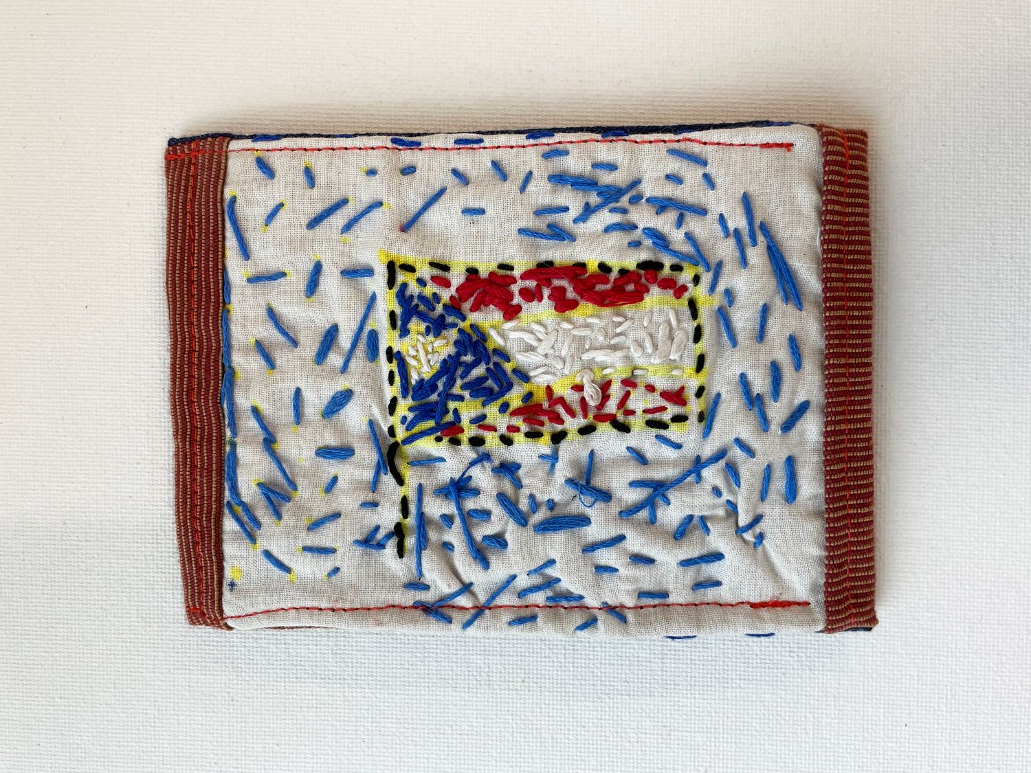 embroidered Puerto Rican flag wallet by Keishla Rosado