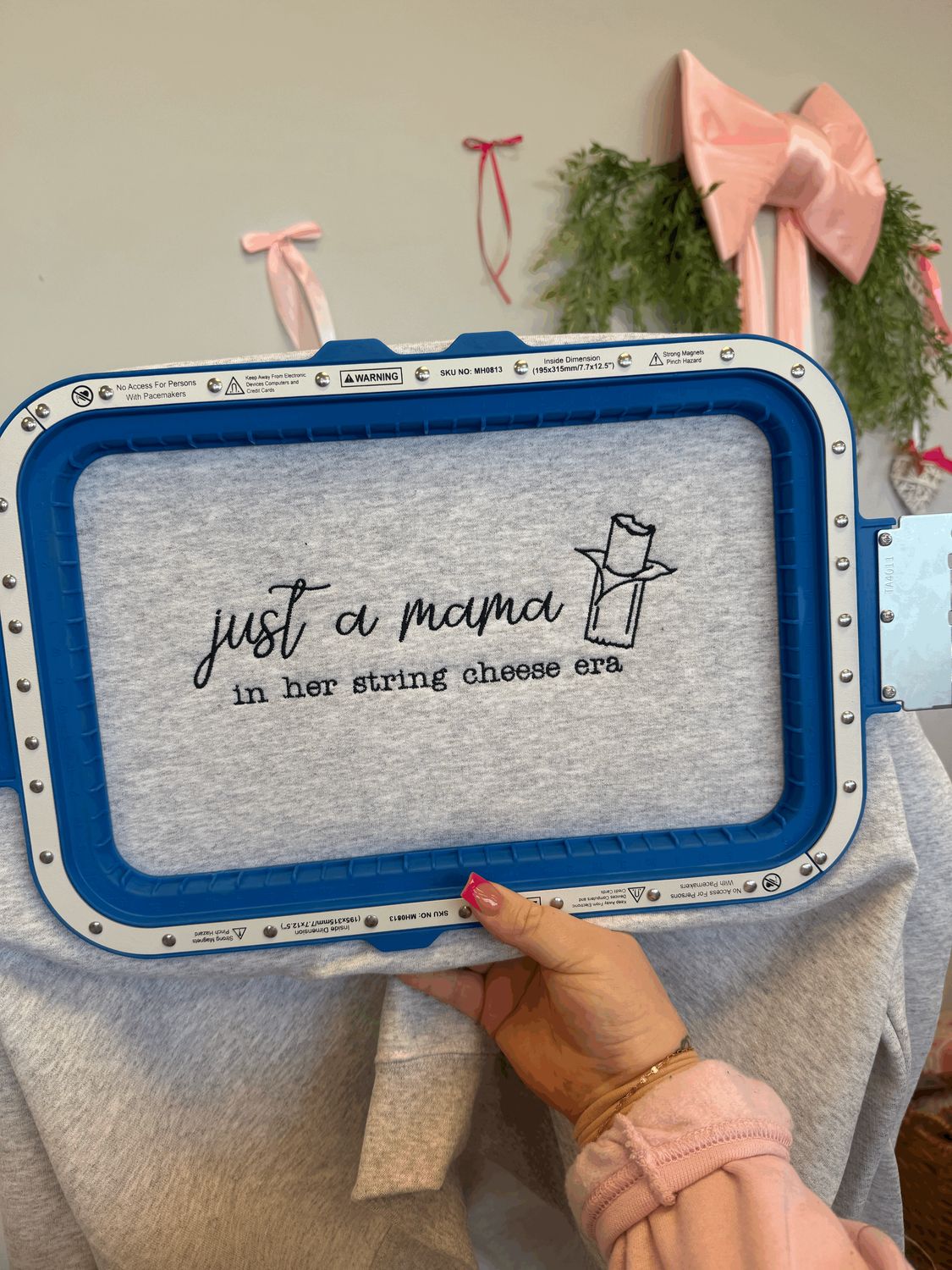 JUST A MAMA IN HER STRING CHEESE SWEATSHIRT