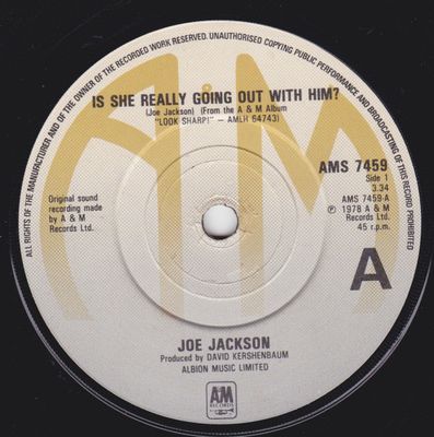 Joe Jackson - Is She Really Going Out With Him? (7&quot;, Single) (Near Mint (NM or M-))