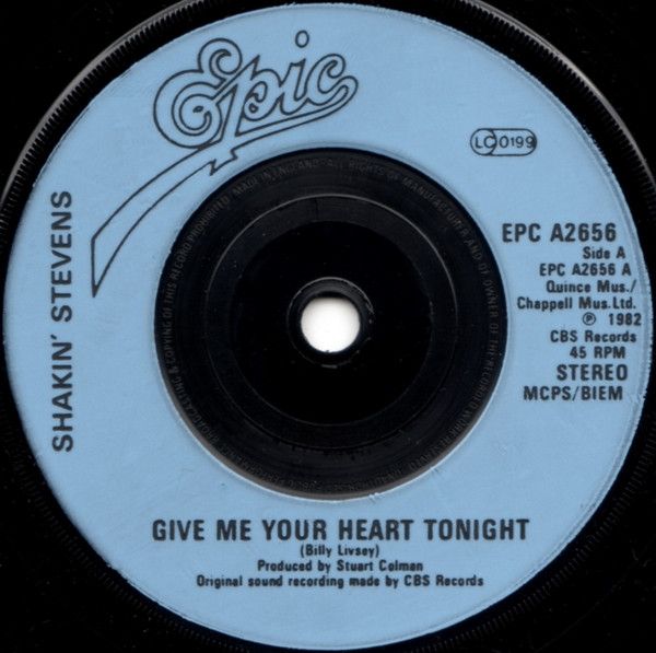 Shakin&#39; Stevens - Give Me Your Heart Tonight (7&quot;, Single, Com) (Near Mint (NM or M-))
