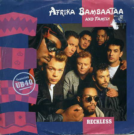 Afrika Bambaataa &amp; Family Featuring UB40 - Reckless (7", Single, Pap) (Very Good Plus (VG+))