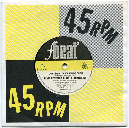 Elvis Costello &amp; The Attractions - I Can't Stand Up For Falling Down (7", Single, Com) (Near Mint (NM or M-))