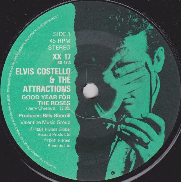 Elvis Costello &amp; The Attractions - Good Year For The Roses (7", Single, Com) (Near Mint (NM or M-))