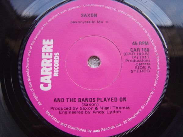 Saxon - And The Bands Played On (7", Single) (Very Good Plus (VG+))