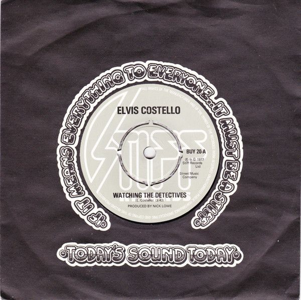 Elvis Costello - Watching The Detectives (7", Single, Sti) (Good Plus (G+))