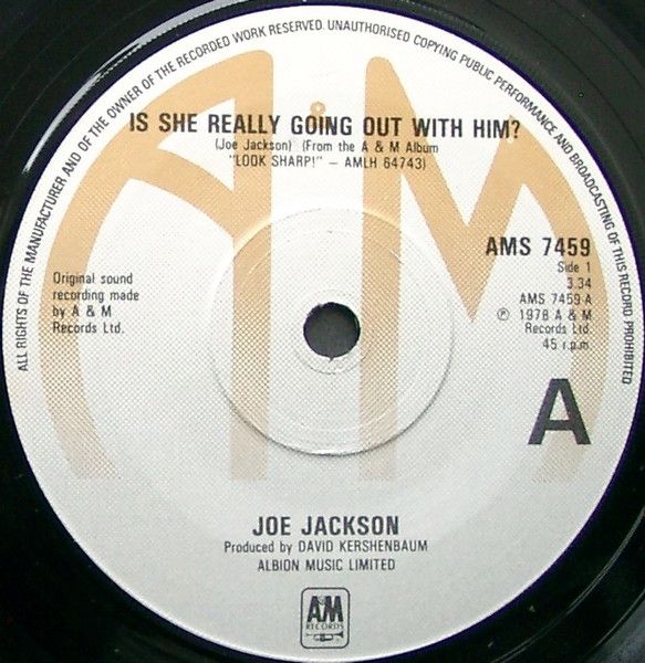 Joe Jackson - Is She Really Going Out With Him? (7", Single, RE) (Very Good Plus (VG+))
