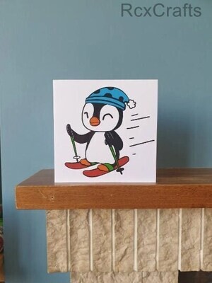 A handmade cut out design skiing penguin Birthday / greetings card.