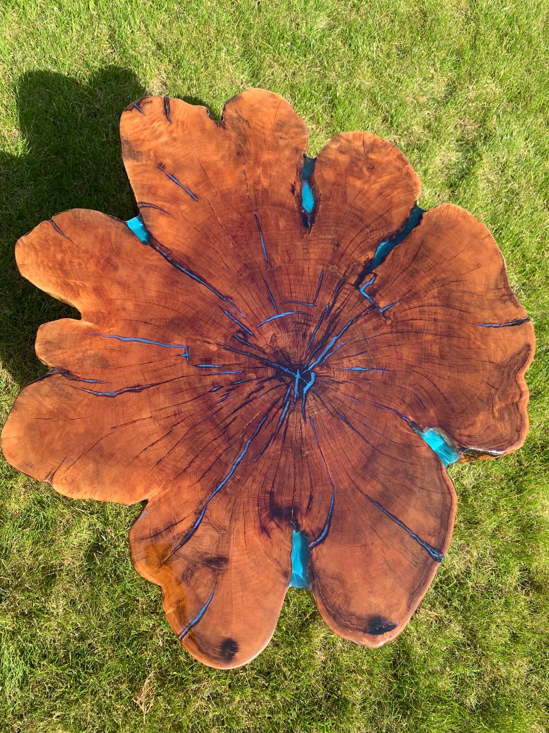 Beautiful hand carved table of noble solid wood and epoxy resin