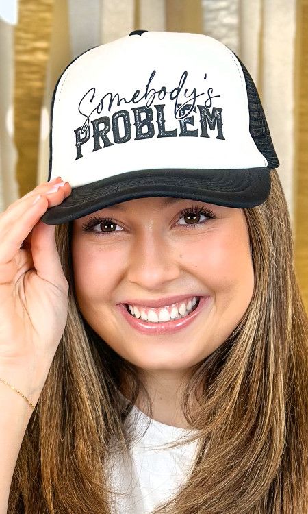 SOMEBODY&#39;S PROBLEM TRUCKER HAT-BLACK/WHITE