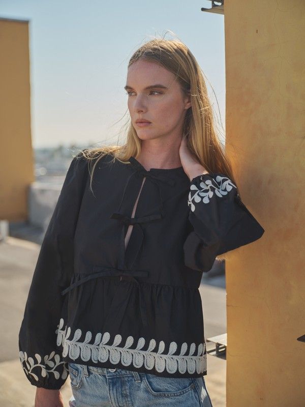 EMBROIDERED BOW TIE PEPLUM BLOUSE