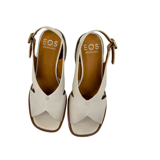 Pair of cream colored sandals with open toe and heel.  Heel strap has adjustable buckle