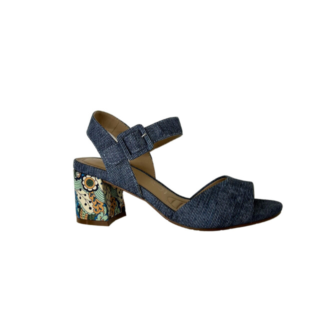 Side view of a beautiful sandal.  Upper is a denim color and heel is a contrasting floral