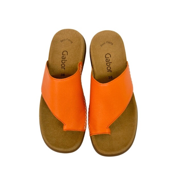 Pair of slip on sandals in a soft orange shade with toe loop