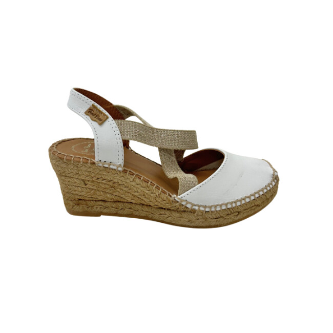 Outside view of a white leather espadrille sandal.    Wedge sole