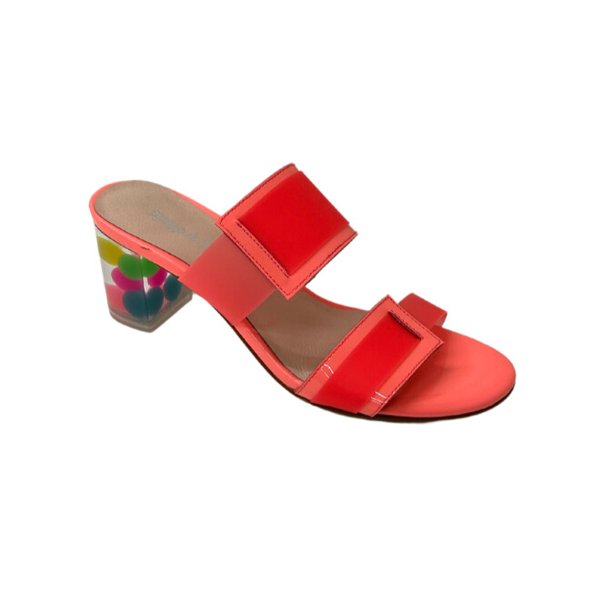 Angled front shot of a slide in a watermelon color.  Mix of leather and lucite with a bubblegum heel