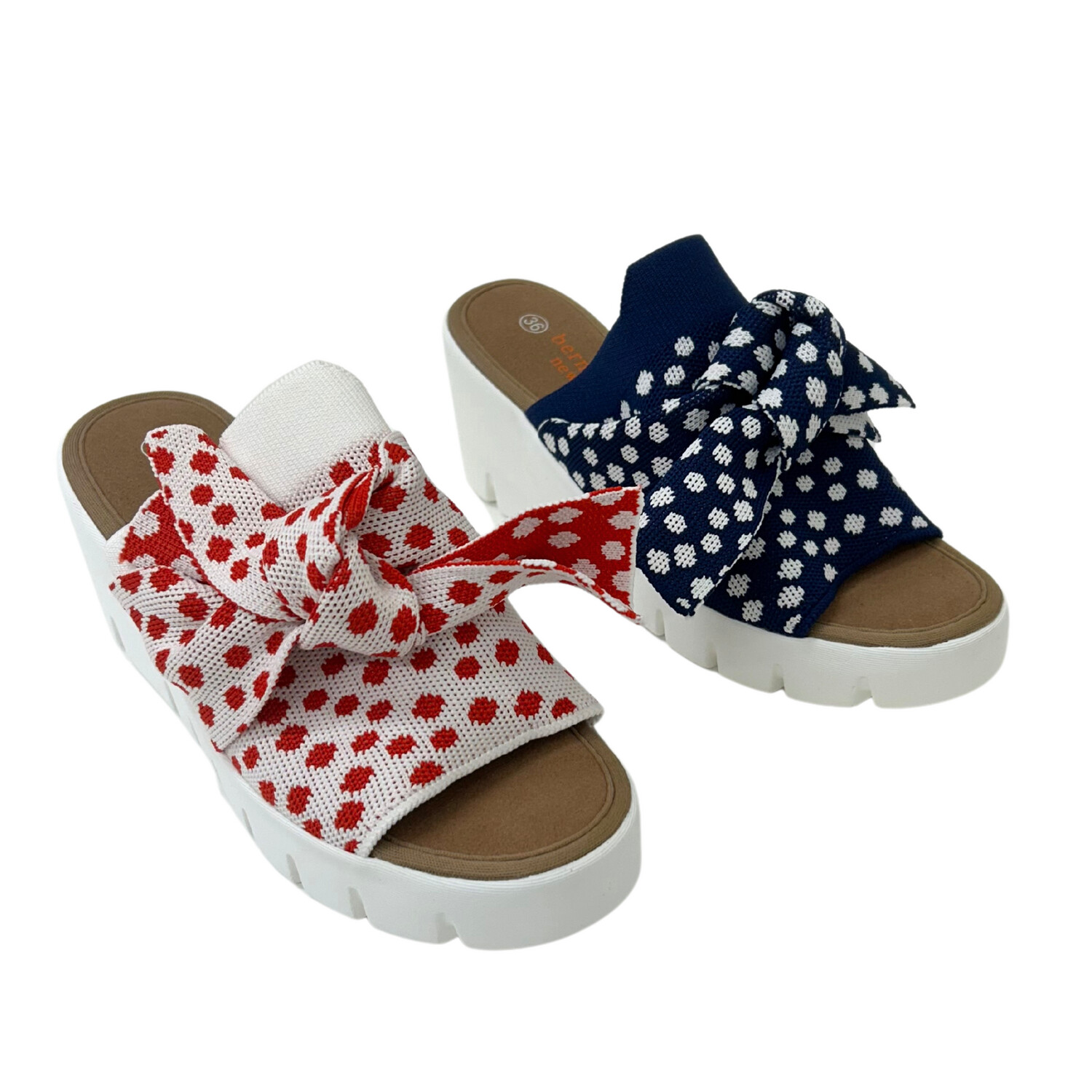 Angled front view of a polka dot sandal in both red and navy